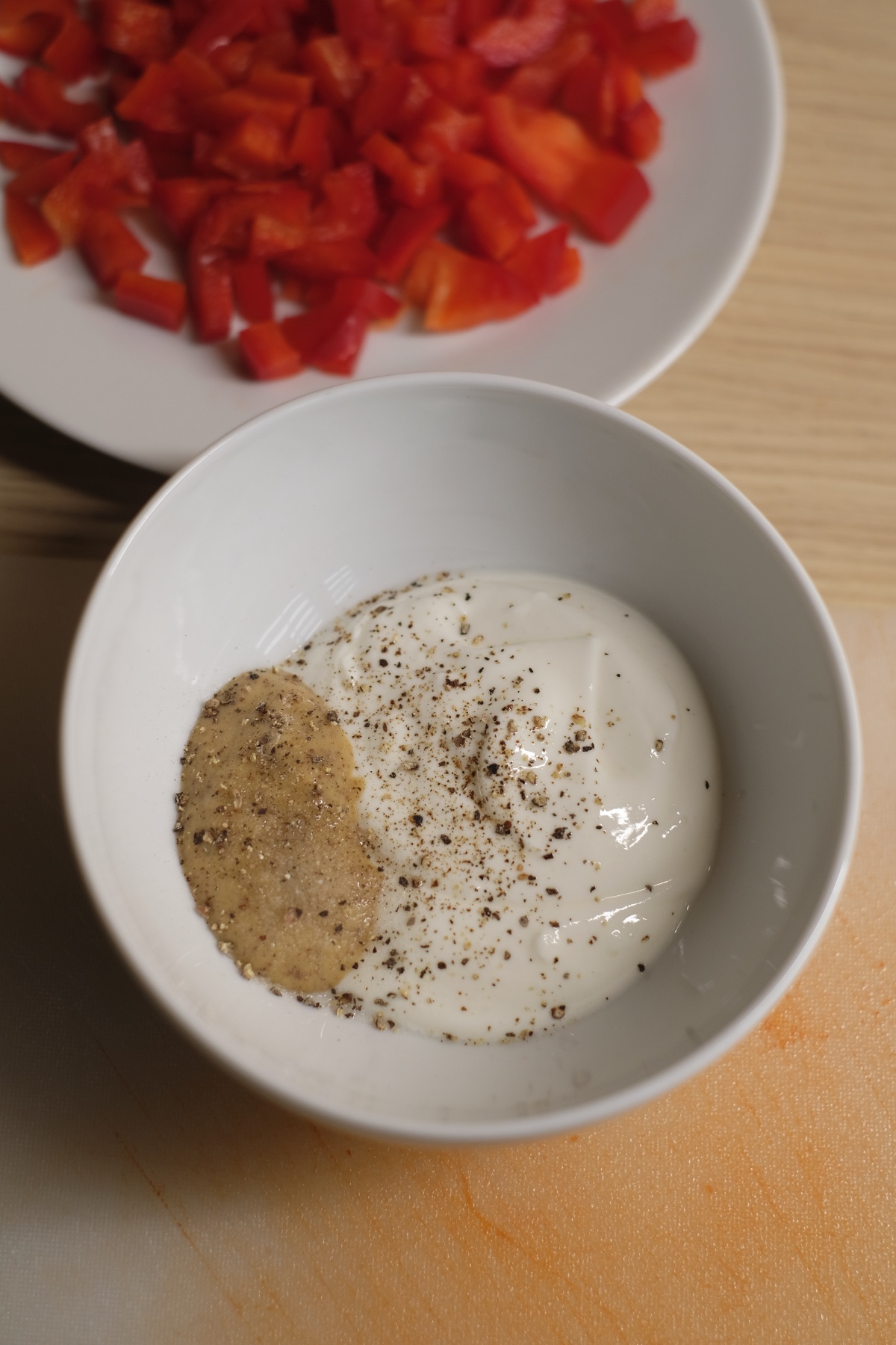 yogurt mustard and pepper in a bowl for dressing