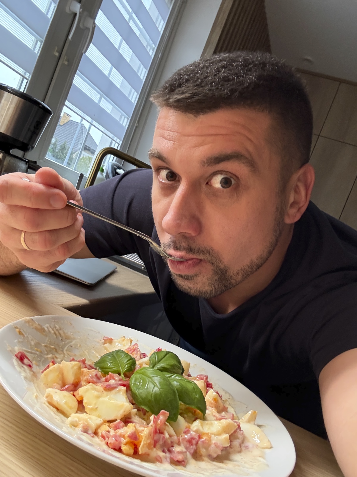 man eating homemade egg salad with yogurt and red pepper
